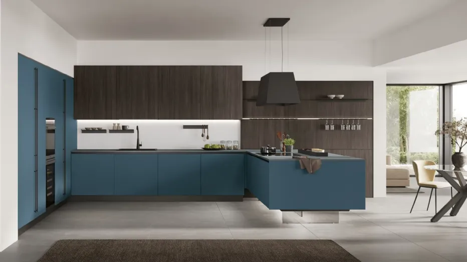 Moka Oak, matt Oltremare, and Sapienstone Blue Steel countertops bring characterful flavours to the kitchen, balanced by the modernity of Basalt and the materiality of Pietra Ghiaia.