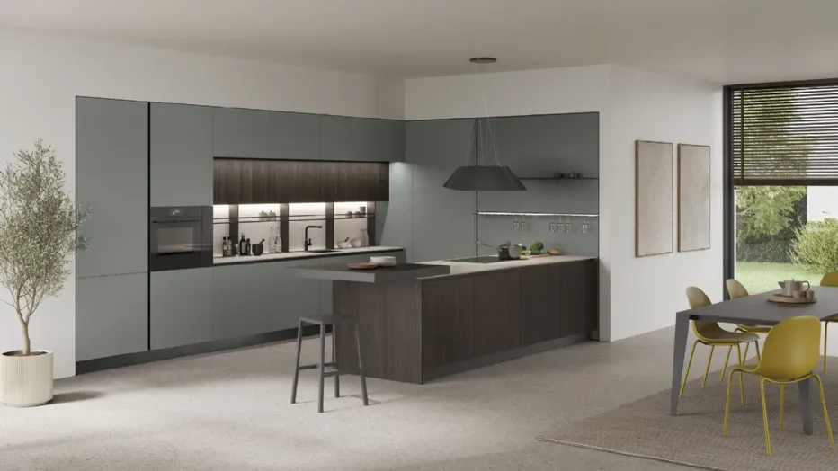 An open space for those who don't want to overcomplicate their lives: from the dining area you go to the kitchen, from the kitchen to the living room and vice versa. Moka and Giada oak, Sapienstone Light Grey countertop.